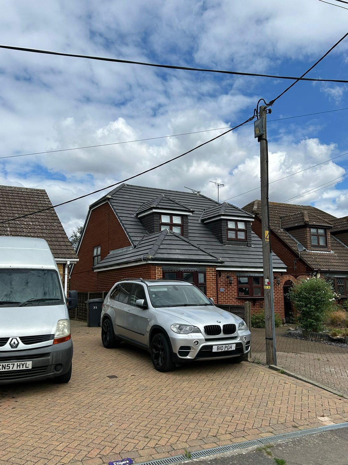 Finished home exterior with a newly completed roof