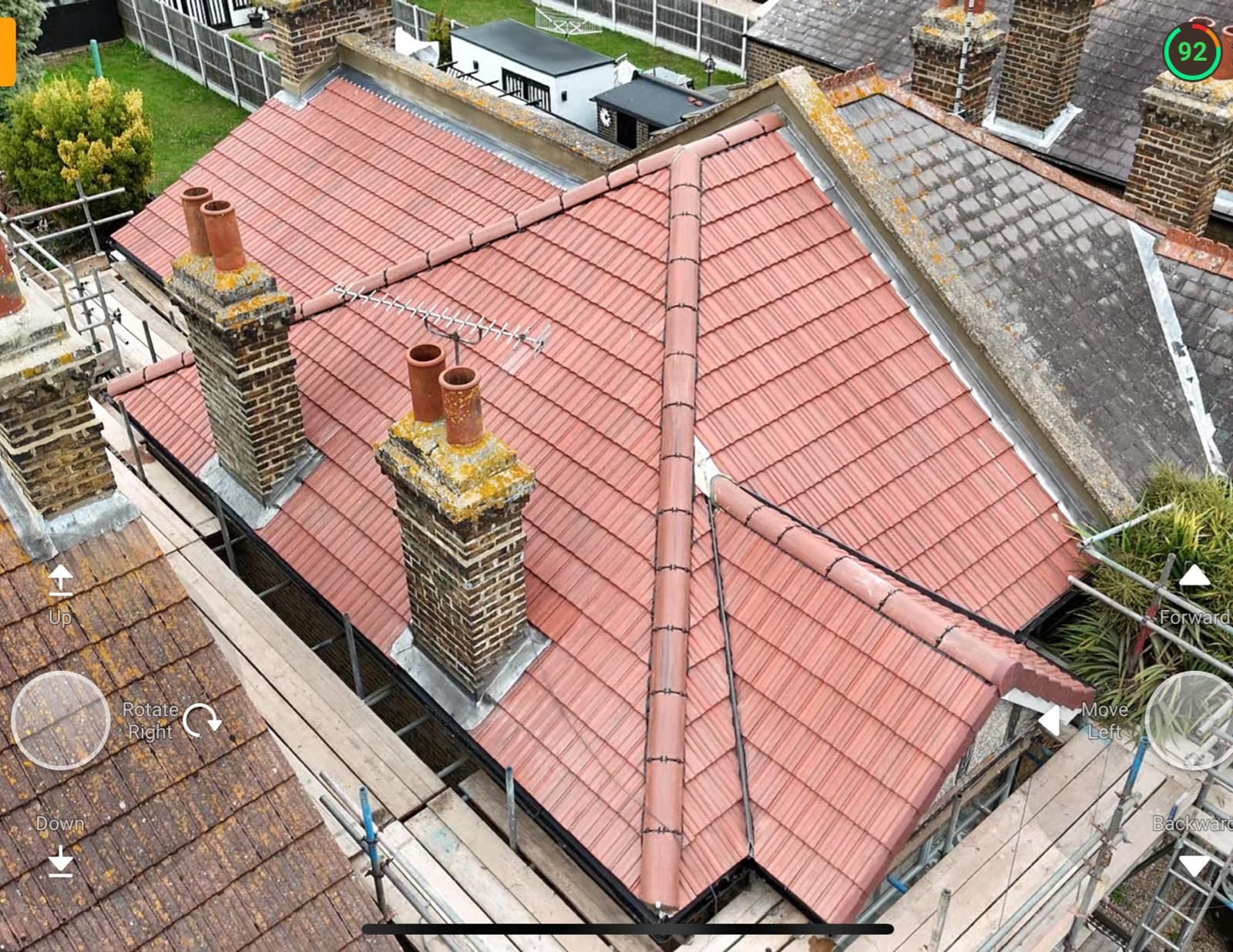 Newly tiled roof with a clean, straight ridge line