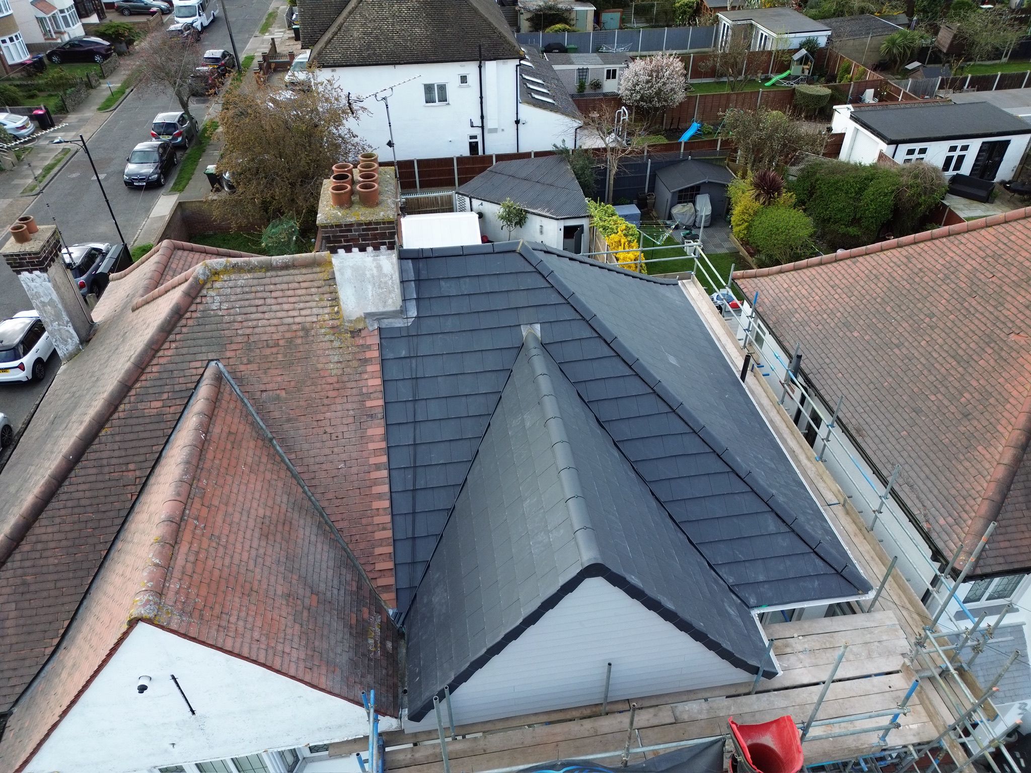 Completed dark grey slate roof on a residential property