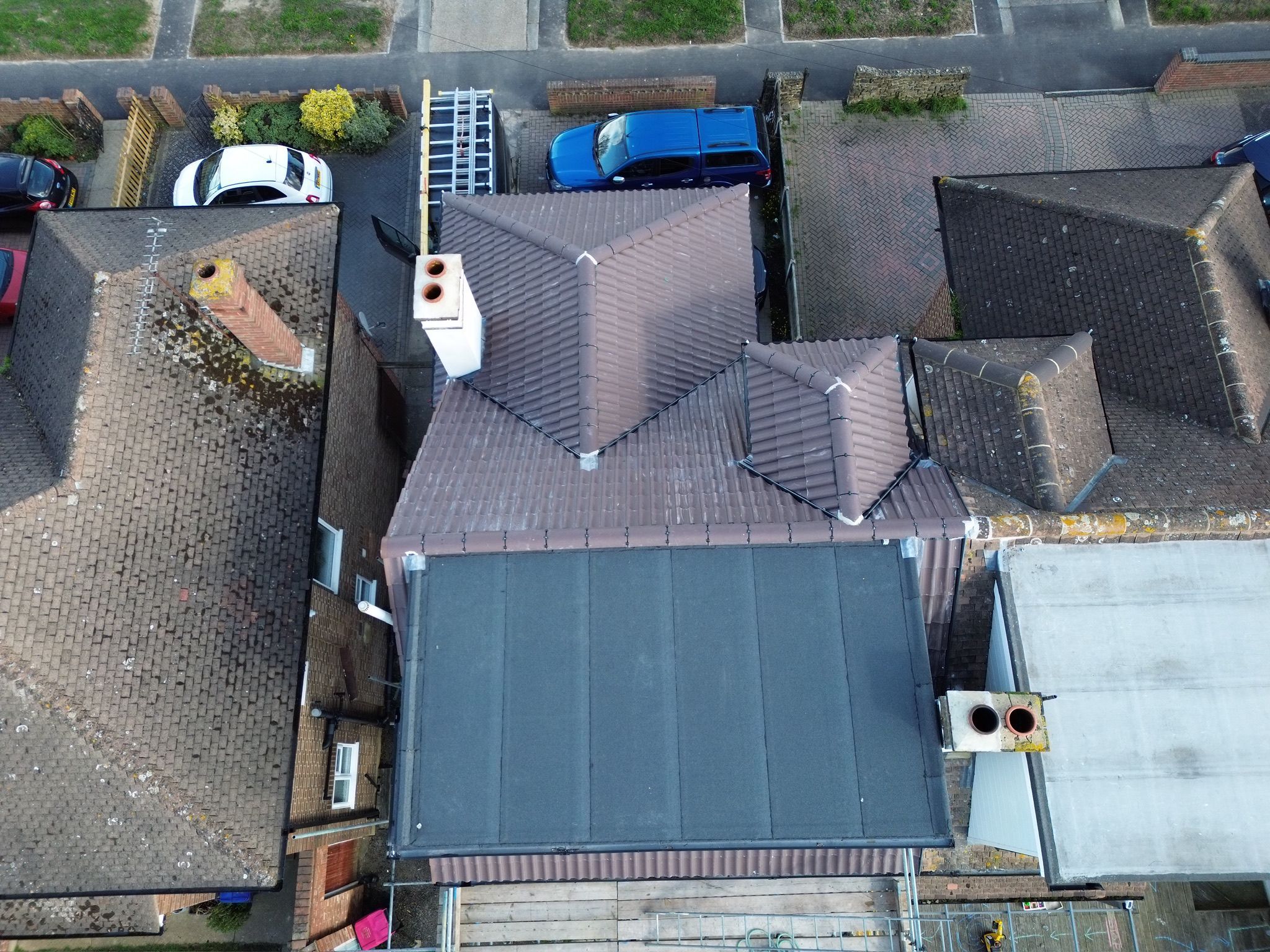 New tiled roof alongside a flat roof section